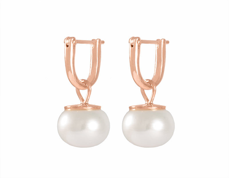 White button pearls in 18k rose gold drops on hoops.