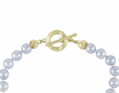 Silver blue Akoya pearl choker with 18k green gold clasp.