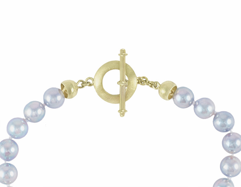 Silver blue Akoya pearl choker with 18k green gold clasp.