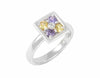 Platinum ring with purple and yellow sapphires and a diamond.